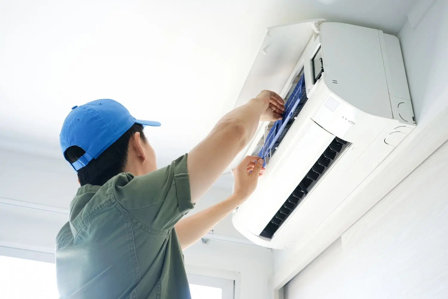 professional technician repairing an AC unit