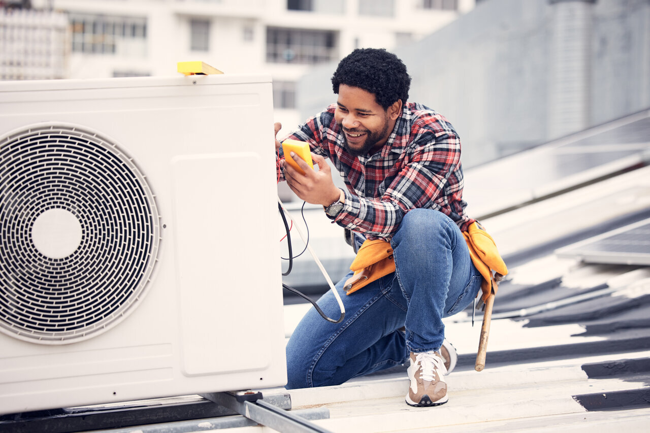 Technician repair an AC unit