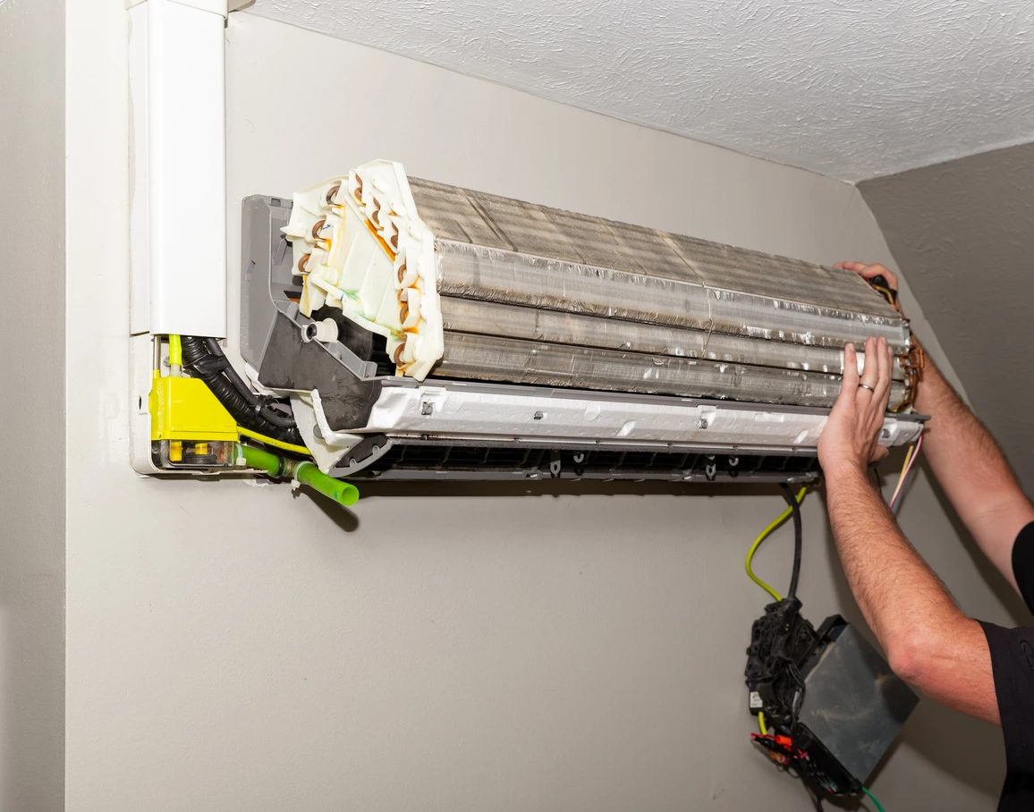 A technician Installing a new mini split unit